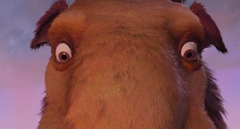 Movie still from “Ice Age” (2002), directed by Chris Wedge – View of the face of a brown animal; Extreme Close Up shot, Low angle