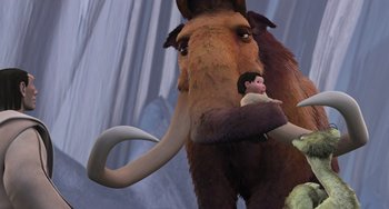Movie still from “Ice Age” (2002), directed by Chris Wedge – An animal with a baby in its mouth; Wide shot, Low angle