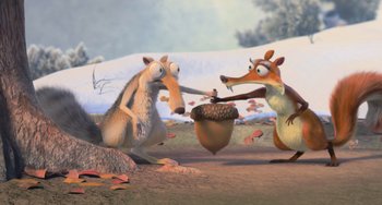Movie still from “Ice Age: Dawn of the Dinosaurs” (2009), directed by Michael Thurmeier – A couple of animals that are standing in the dirt; Wide shot, High angle