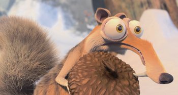 Movie still from “Ice Age: Dawn of the Dinosaurs” (2009), directed by Michael Thurmeier – An animated squirrel with big brown eyes and a big furry tail; Close Up shot, High angle