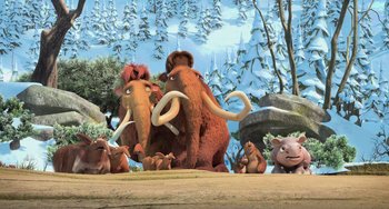 Movie still from “Ice Age: Dawn of the Dinosaurs” (2009), directed by Michael Thurmeier – A group of animals that are standing in the grass; Wide shot, Low angle