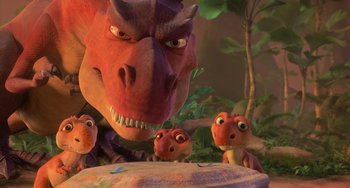 Movie still from “Ice Age: Dawn of the Dinosaurs” (2009), directed by Michael Thurmeier – A red and brown dragon with three baby dinosaurs; Wide shot, High angle