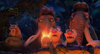 Movie still from “Ice Age: Dawn of the Dinosaurs” (2009), directed by Michael Thurmeier – A group of animals that are standing in the dirt; Medium shot, High angle