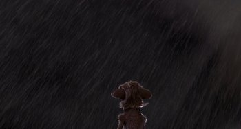Movie still from “Ice Age: Dawn of the Dinosaurs” (2009), directed by Michael Thurmeier – A dog standing in the middle of the night in the rain; Wide shot, Low angle