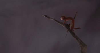 Movie still from “Ice Age: Dawn of the Dinosaurs” (2009), directed by Michael Thurmeier – An animal is climbing on a tree branch; Wide shot, High angle