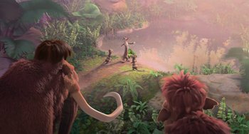 Movie still from “Ice Age: Dawn of the Dinosaurs” (2009), directed by Michael Thurmeier – A group of people standing in the grass near a body of water; Wide shot, Over the shoulder angle