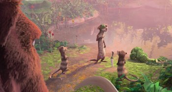 Movie still from “Ice Age: Dawn of the Dinosaurs” (2009), directed by Michael Thurmeier – A group of animals that are standing in the grass; Wide shot, Over the shoulder angle