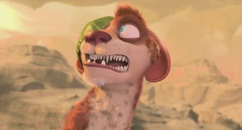 Movie still from “Ice Age: Dawn of the Dinosaurs” (2009), directed by Michael Thurmeier – An animated dog with a green object in its mouth; Close Up shot, Low angle