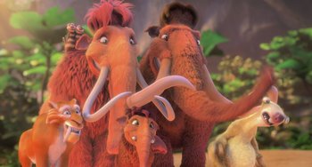Movie still from “Ice Age: Dawn of the Dinosaurs” (2009), directed by Michael Thurmeier – A group of cartoon characters with long necks and tusks; Wide shot, High angle