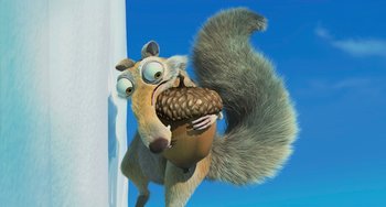 Movie still from “Ice Age: The Meltdown” (2006), directed by Carlos Saldanha – An animated squirrel holding an acorn in its mouth; Medium shot, High angle