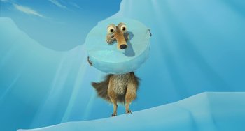 Movie still from “Ice Age: The Meltdown” (2006), directed by Carlos Saldanha – An ice age character with an ice disc on his head; Wide shot, High angle