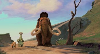 Movie still from “Ice Age: The Meltdown” (2006), directed by Carlos Saldanha – An animated scene of an elephant with tusks and tusks; Wide shot, Low angle