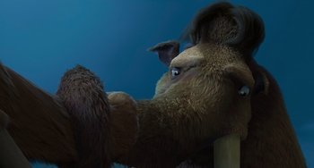 Movie still from “Ice Age: The Meltdown” (2006), directed by Carlos Saldanha – A large stuffed animal sitting on top of a wooden post; Close Up shot, Over the shoulder angle