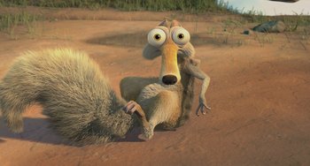 Movie still from “Ice Age: The Meltdown” (2006), directed by Carlos Saldanha – An animal with big eyes is sitting in the dirt; Medium shot, High angle