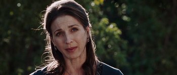 Movie still from “Imagine That” (2009), directed by Karey Kirkpatrick – A person with long dark hair; Close Up shot, Over the shoulder angle