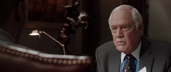 Movie still from “Imagine That” (2009), directed by Karey Kirkpatrick – An older man sitting in front of a piano; Close Up shot, Over the shoulder angle