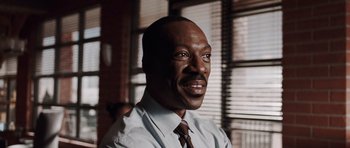 Movie still from “Imagine That” (2009), directed by Karey Kirkpatrick – A person wearing a shirt and a tie; Close Up shot, Low angle