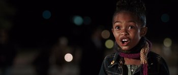 Movie still from “Imagine That” (2009), directed by Karey Kirkpatrick – A little girl is smiling for the camera; Close Up shot, Over the shoulder angle