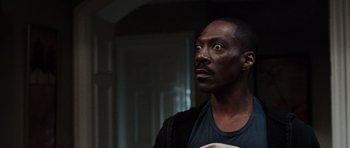 Movie still from “Imagine That” (2009), directed by Karey Kirkpatrick – A person looking up at something; Close Up shot, Low angle