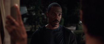 Movie still from “Imagine That” (2009), directed by Karey Kirkpatrick – A person wearing a black shirt; Close Up shot, High angle