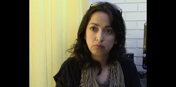 Movie still from “In Broad Daylight: The Narvarte Case” (2022), directed by Alberto Saúl Arnaut Estrada – A person wearing a black shirt; Close Up shot, Low angle