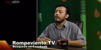 Movie still from “In Broad Daylight: The Narvarte Case” (2022), directed by Alberto Saúl Arnaut Estrada – A man sitting in front of a computer screen; Medium shot, High angle