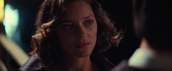 Movie still from “Inception” (2010), directed by Christopher Nolan – A woman's face in the dark; Close Up shot, Over the shoulder angle