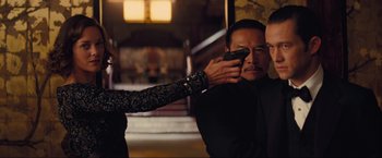 Movie still from “Inception” (2010), directed by Christopher Nolan – A man and a woman looking at a cell phone; Medium shot, Over the shoulder angle