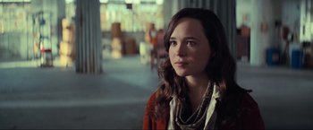Movie still from “Inception” (2010), directed by Christopher Nolan – A woman with long hair is looking to her left; Close Up shot, Over the shoulder angle