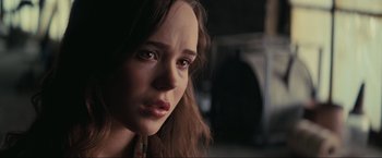 Movie still from “Inception” (2010), directed by Christopher Nolan – A person with long hair; Close Up shot, Over the shoulder angle