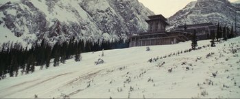 Movie still from “Inception” (2010), directed by Christopher Nolan – A building on top of a snow covered slope; Extreme Wide shot, High angle