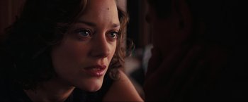 Movie still from “Inception” (2010), directed by Christopher Nolan – A woman's face in the dark; Close Up shot, Over the shoulder angle