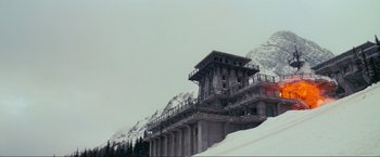Movie still from “Inception” (2010), directed by Christopher Nolan – An abandoned building on the side of a ski slope; Extreme Wide shot, Low angle