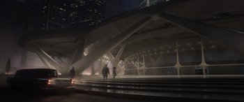 Movie still from “Incredibles 2” (2018), directed by Brad Bird – Two people are walking down the steps in the dark; Extreme Wide shot, High angle