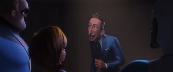 Movie still from “Incredibles 2” (2018), directed by Brad Bird – A cartoon of a man talking to a woman in front of him; Medium shot, Over the shoulder angle