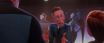 Movie still from “Incredibles 2” (2018), directed by Brad Bird – An animated man in a blue suit talking to someone; Medium shot, Over the shoulder angle