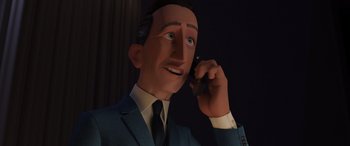 Movie still from “Incredibles 2” (2018), directed by Brad Bird – A man talking on a cell phone while wearing a suit and tie; Close Up shot, Low angle