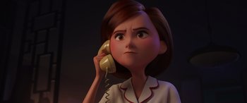 Movie still from “Incredibles 2” (2018), directed by Brad Bird – An animated woman talking on a yellow phone; Close Up shot, Low angle