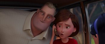 Movie still from “Incredibles 2” (2018), directed by Brad Bird – A man and a woman are standing next to each other on a cell phone; Close Up shot, Over the shoulder angle