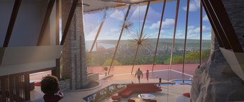 Movie still from “Incredibles 2” (2018), directed by Brad Bird – Two people walking in a room with a view of a city; Extreme Wide shot, High angle