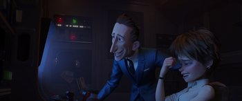Movie still from “Incredibles 2” (2018), directed by Brad Bird – A man in a blue suit and tie with his head turned to the side; Medium shot, Over the shoulder angle
