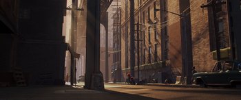 Movie still from “Incredibles 2” (2018), directed by Brad Bird – An image of a city street with a person sitting on the sidewalk; Extreme Wide shot, Low angle