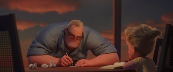 Movie still from “Incredibles 2” (2018), directed by Brad Bird – A man is writing on a paper at a desk; Medium shot, Over the shoulder angle