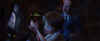 Movie still from “Incredibles 2” (2018), directed by Brad Bird – A boy and an old man in a dark room; Medium shot, Over the shoulder angle