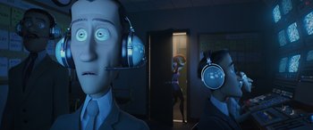 Movie still from “Incredibles 2” (2018), directed by Brad Bird – Two people in a room with headphones on; Medium shot, Low angle