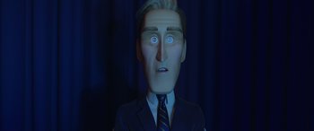 Movie still from “Incredibles 2” (2018), directed by Brad Bird – A man in a suit and tie with a surprised look on his face; Close Up shot, Low angle