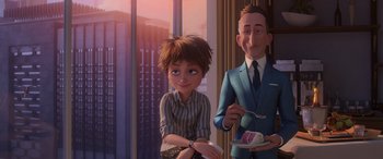Movie still from “Incredibles 2” (2018), directed by Brad Bird – A boy sitting next to a man in a suit; Medium shot, Over the shoulder angle