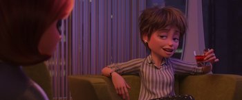 Movie still from “Incredibles 2” (2018), directed by Brad Bird – A woman sitting on a couch in front of a curtain; Close Up shot, Over the shoulder angle