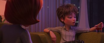 Movie still from “Incredibles 2” (2018), directed by Brad Bird – A woman sitting on a couch next to another woman; Close Up shot, Over the shoulder angle