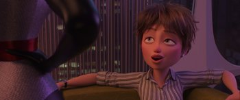 Movie still from “Incredibles 2” (2018), directed by Brad Bird – A cartoon of a boy looking at the camera; Close Up shot, Over the shoulder angle